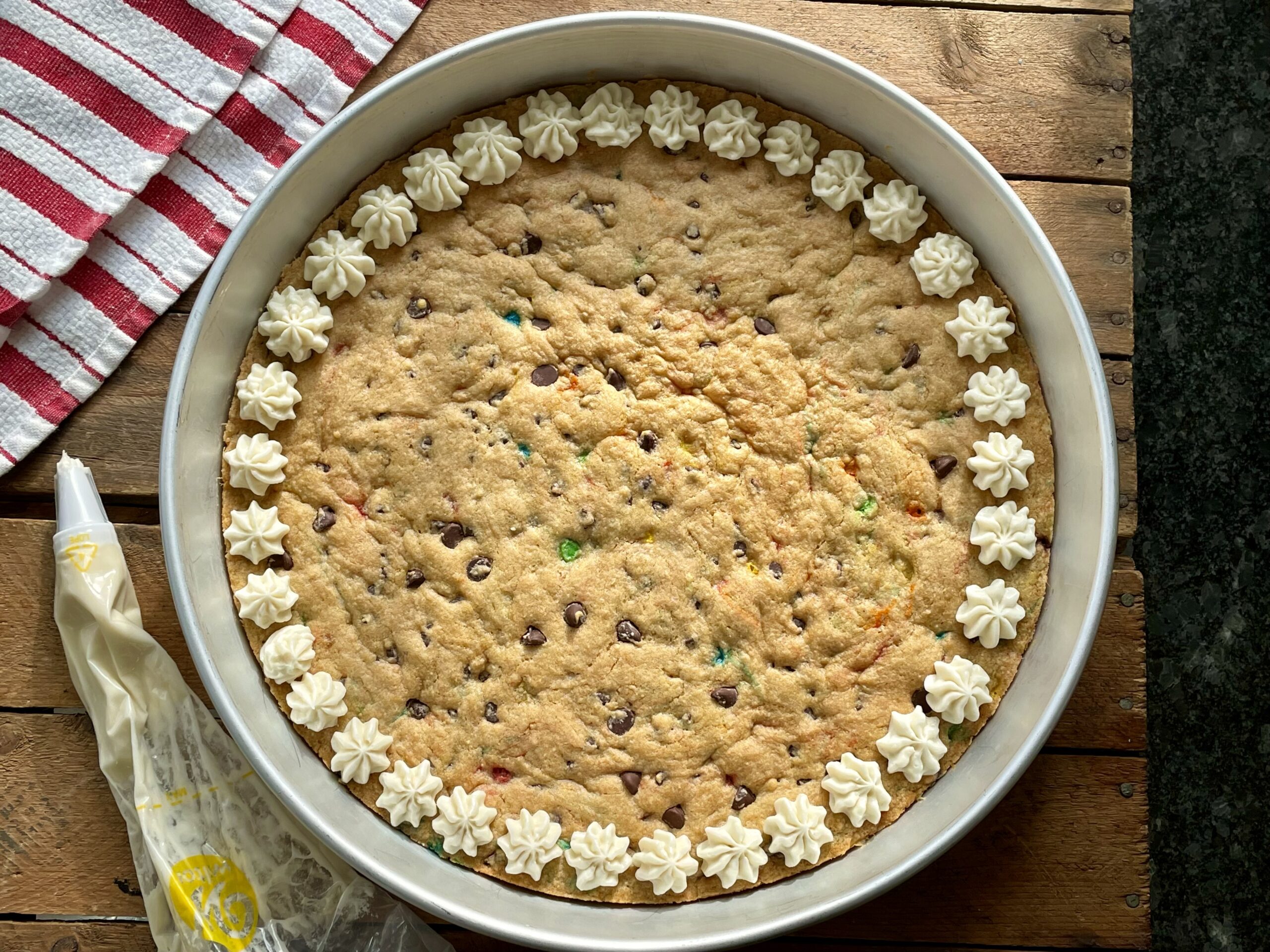 A cookie cake is a fun and festive alternative to regular cookies – and faster too!